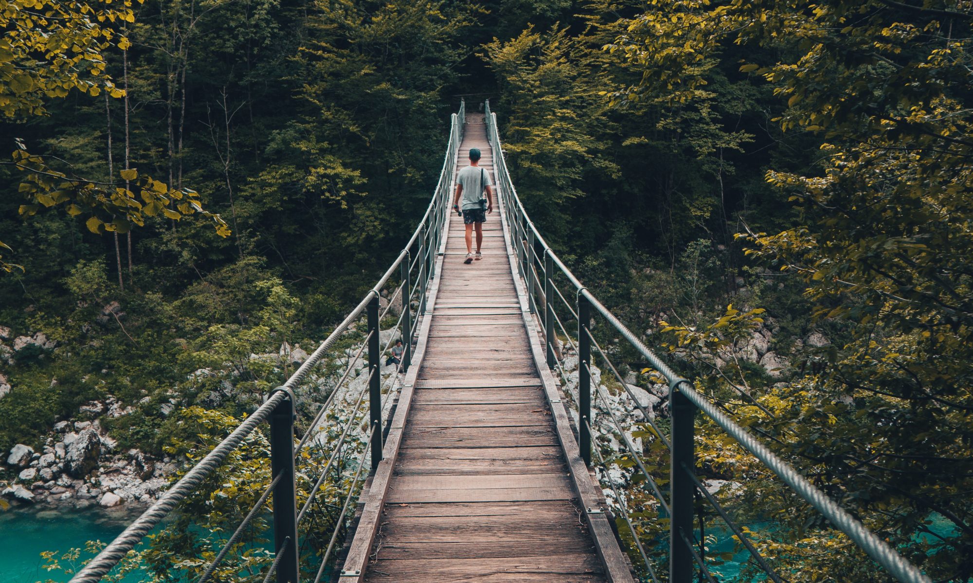 modern internet can take us anywhere, man traveling on a bridge